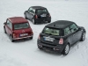 tre-generazioni-di-mini-cooper-tre-quarti-posteriore